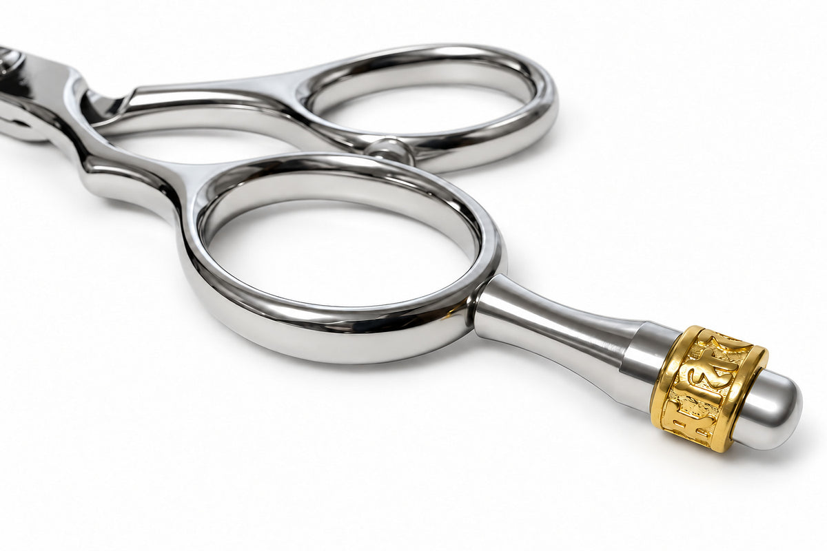 Gold-tone crown capping the finger-rest tang on the Ichiro Crown Lefty hairdressing scissors